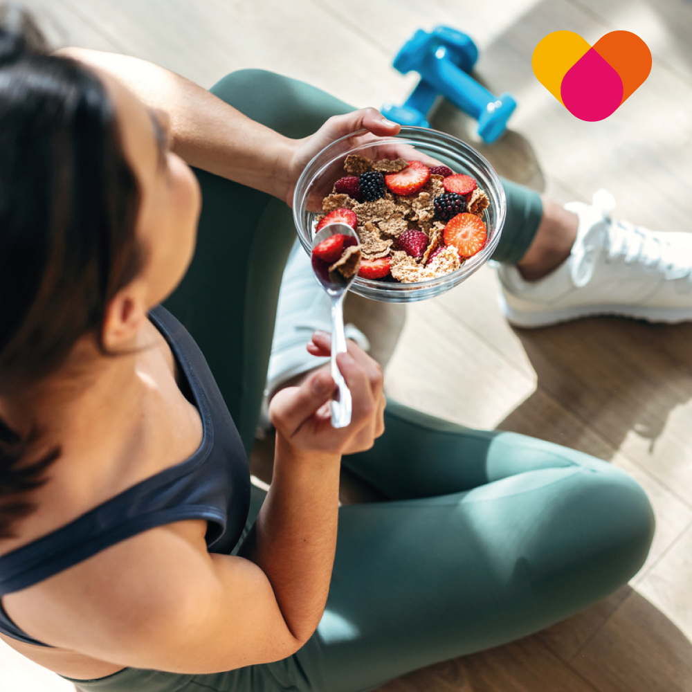 Healthy Youung Woman Eating fruit and cereal