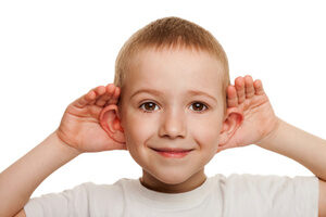 Child cupping their ears