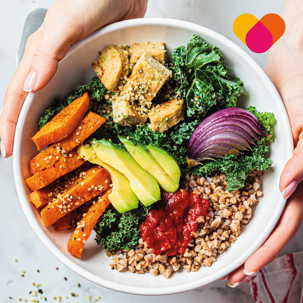 Woman Holding A Bowl Filled With Healthy Seeds Leaves and Vegetables