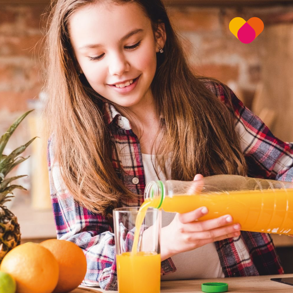 Healthy Teenage Pouring Juice