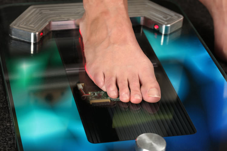 Mans foot being scanned for orthotics