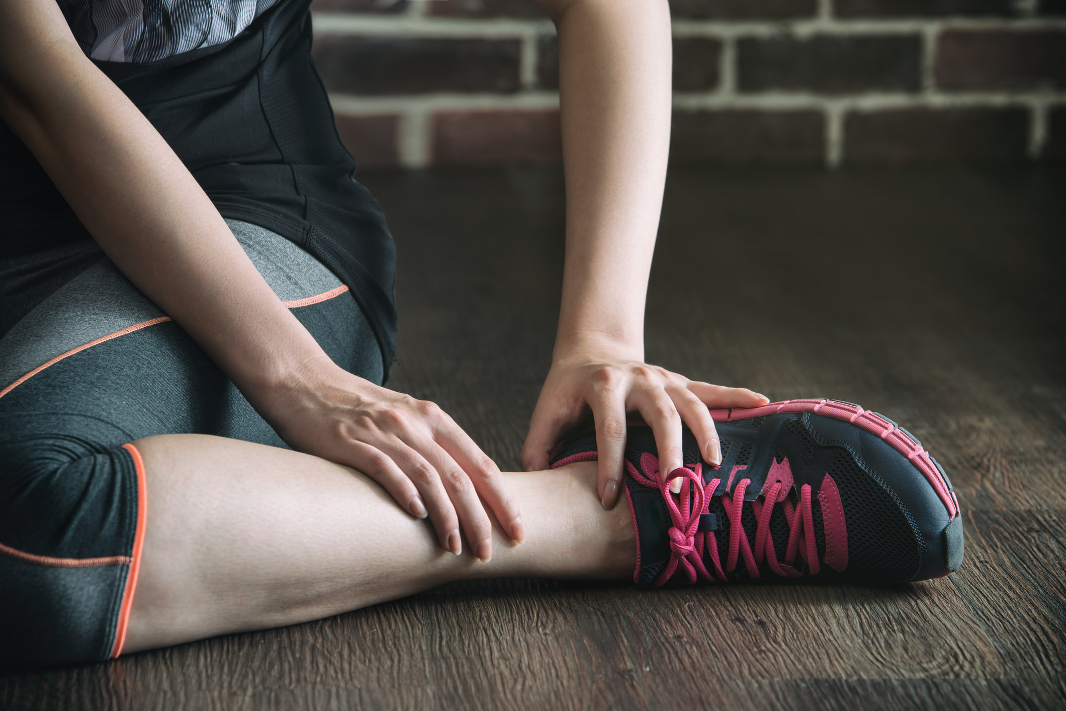 Woman nursing a sprained ankle